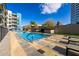 Inviting swimming pool with clear blue water, surrounded by lounge chairs and landscaped greenery in a serene setting at 3131 N Central Ave # 6010, Phoenix, AZ 85012