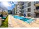 Inviting pool area with a spa, lounge chairs, and landscaping for a resort-style experience in the community at 3131 N Central Ave # 6010, Phoenix, AZ 85012