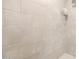 Neutral toned tile shower is equipped with a rainfall showerhead and built in shelving unit at 3131 N Central Ave # 6010, Phoenix, AZ 85012