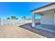 Spacious backyard featuring block wall, covered patio, and ample space for outdoor activities at 32017 N Redding St, Wittmann, AZ 85361