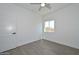 Neutral bedroom with a ceiling fan, closet with sliding doors, and window at 32017 N Redding St, Wittmann, AZ 85361