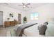 Calm bedroom with a view, light-colored walls, and decor at 32017 N Redding St, Wittmann, AZ 85361