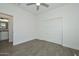 Bedroom with ceiling fan, closet with sliding doors, and a door leading to the bathroom at 32017 N Redding St, Wittmann, AZ 85361