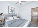 Comfortable bedroom with a gray headboard and geometric accents and closet at 32017 N Redding St, Wittmann, AZ 85361
