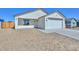 Charming single-story home with a well-maintained facade, two-car garage and desert landscaping at 32017 N Redding St, Wittmann, AZ 85361