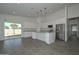 Modern kitchen featuring white cabinets, stainless steel appliances, granite countertops and pendant lighting at 32017 N Redding St, Wittmann, AZ 85361