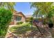 Beautiful backyard featuring lush lawn, mature trees, a BBQ grill, and a relaxing hammock at 3313 W Five Mile Peak Dr, San Tan Valley, AZ 85144