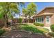 Beautiful, well-maintained backyard with lush lawn, mature trees, and cozy hammock at 3313 W Five Mile Peak Dr, San Tan Valley, AZ 85144