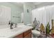 Bright bathroom features a shower with a playful cactus-themed curtain, modern sink, and neutral paint at 3313 W Five Mile Peak Dr, San Tan Valley, AZ 85144