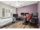 This bedroom is complete with a ceiling fan, modern workstation, and relaxing natural light at 3313 W Five Mile Peak Dr, San Tan Valley, AZ 85144