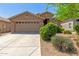 Charming single-story home with a two-car garage, desert landscaping, and neutral stucco exterior at 3313 W Five Mile Peak Dr, San Tan Valley, AZ 85144