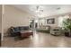 Comfortable living room with tile floors, neutral walls, and a ceiling fan with lots of natural light at 3313 W Five Mile Peak Dr, San Tan Valley, AZ 85144