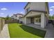 Low maintenance backyard features artificial grass, stone pavers and covered patio at 3330 E Carla Vista Dr, Gilbert, AZ 85295