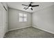 Neutral bedroom featuring a ceiling fan, carpeted floors, and a window providing natural light at 3330 E Carla Vista Dr, Gilbert, AZ 85295