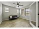 Bright bedroom with hardwood floors, ceiling fan, and ample natural light, creating a comfortable space at 3330 E Carla Vista Dr, Gilbert, AZ 85295