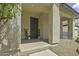 Inviting covered porch with decorative accents, enhancing the entrance with charm and style at 3330 E Carla Vista Dr, Gilbert, AZ 85295
