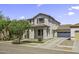 Charming two-story home with desert landscaping and a covered porch, showcasing curb appeal and a welcoming entrance at 3330 E Carla Vista Dr, Gilbert, AZ 85295