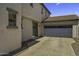 Attached two-car garage and sliding door leading into the home from the driveway at 3330 E Carla Vista Dr, Gilbert, AZ 85295