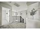 Bright landing featuring iron railing, modern light fixture and an arched opening with a decorative plant at 3330 E Carla Vista Dr, Gilbert, AZ 85295