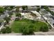 Aerial view of neighborhood park featuring a playground, covered picnic area and open green space at 3330 E Carla Vista Dr, Gilbert, AZ 85295