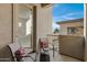Outdoor balcony space perfect for relaxing with comfortable chairs and pillows at 3330 S Gilbert Rd # 2021, Chandler, AZ 85286