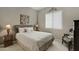 Cozy bedroom with a plush bed, side tables, and a window for natural light at 3330 S Gilbert Rd # 2021, Chandler, AZ 85286