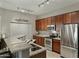 Open kitchen with granite countertops, stainless steel appliances, breakfast bar, and recessed lighting at 3330 S Gilbert Rd # 2021, Chandler, AZ 85286