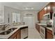Stylish kitchen with stainless steel appliances, granite countertops, recessed lighting, and tiled floors at 3330 S Gilbert Rd # 2021, Chandler, AZ 85286