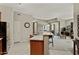 Well-lit kitchen with granite countertops and views into dining and living spaces at 3330 S Gilbert Rd # 2021, Chandler, AZ 85286
