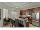 Bright kitchen with stainless steel appliances, granite countertops, and stylish breakfast bar seating at 3330 S Gilbert Rd # 2021, Chandler, AZ 85286