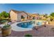 Private backyard featuring a sparkling pool, mature landscaping, and a covered patio, ideal for outdoor living at 4089 E Peach Tree Dr, Chandler, AZ 85249