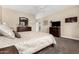 Comfortable bedroom featuring wood dresser, TV, and plush bedding, creating a relaxing retreat at 4089 E Peach Tree Dr, Chandler, AZ 85249