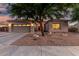 Charming single-story home with a well-maintained xeriscaped yard and a two-car garage at 4089 E Peach Tree Dr, Chandler, AZ 85249