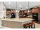Spacious kitchen with granite countertops, stainless steel appliances, and wooden cabinets at 4089 E Peach Tree Dr, Chandler, AZ 85249