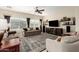 Comfortable living room featuring a ceiling fan, large window, and stylish decor at 4089 E Peach Tree Dr, Chandler, AZ 85249