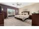 Large main bedroom with plush carpeting, a ceiling fan, and a sunlit window at 4089 E Peach Tree Dr, Chandler, AZ 85249