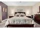 Tranquil main bedroom featuring a decorative headboard, soft lighting, and a calming color palette at 4089 E Peach Tree Dr, Chandler, AZ 85249