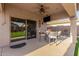 Covered patio featuring outdoor dining set and a mounted TV, ideal for entertainment at 4089 E Peach Tree Dr, Chandler, AZ 85249