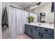 Updated bathroom features modern vanity, a large mirror, and tiled floors at 4109 E Chambers St, Phoenix, AZ 85040