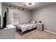 Cozy bedroom featuring a single bed, dresser, and decorative planet accents at 4109 E Chambers St, Phoenix, AZ 85040