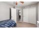 Cozy bedroom featuring carpet, closet, and ceiling fan at 4109 E Chambers St, Phoenix, AZ 85040