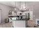 Bright kitchen showcases an island, stainless steel appliances, and pendant lighting at 4109 E Chambers St, Phoenix, AZ 85040