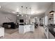 Open-concept living space showcasing the kitchen, dining room, and living room at 4109 E Chambers St, Phoenix, AZ 85040
