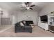 Spacious living room features comfortable sectional sofa, shelving and neutral color palette at 4109 E Chambers St, Phoenix, AZ 85040