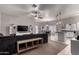 Open-concept living room with comfortable seating, tile flooring, and a ceiling fan at 4109 E Chambers St, Phoenix, AZ 85040