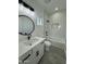 Modern bathroom featuring a tub, shower, and sleek vanity with stylish fixtures and finishes at 4116 E Park St, Phoenix, AZ 85042
