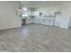 Open-concept home featuring a modern kitchen with subway tile and light countertops at 4116 E Park St, Phoenix, AZ 85042