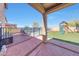 Gorgeous backyard featuring a pool, playground, turf and outdoor kitchen at 4138 N 298Th Ln, Buckeye, AZ 85396