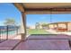 Entertain outdoors in this backyard with turf, playground, outdoor kitchen and private pool! at 4138 N 298Th Ln, Buckeye, AZ 85396