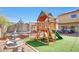 Backyard with playset, trampoline, fountain, and outdoor seating area at 4138 N 298Th Ln, Buckeye, AZ 85396